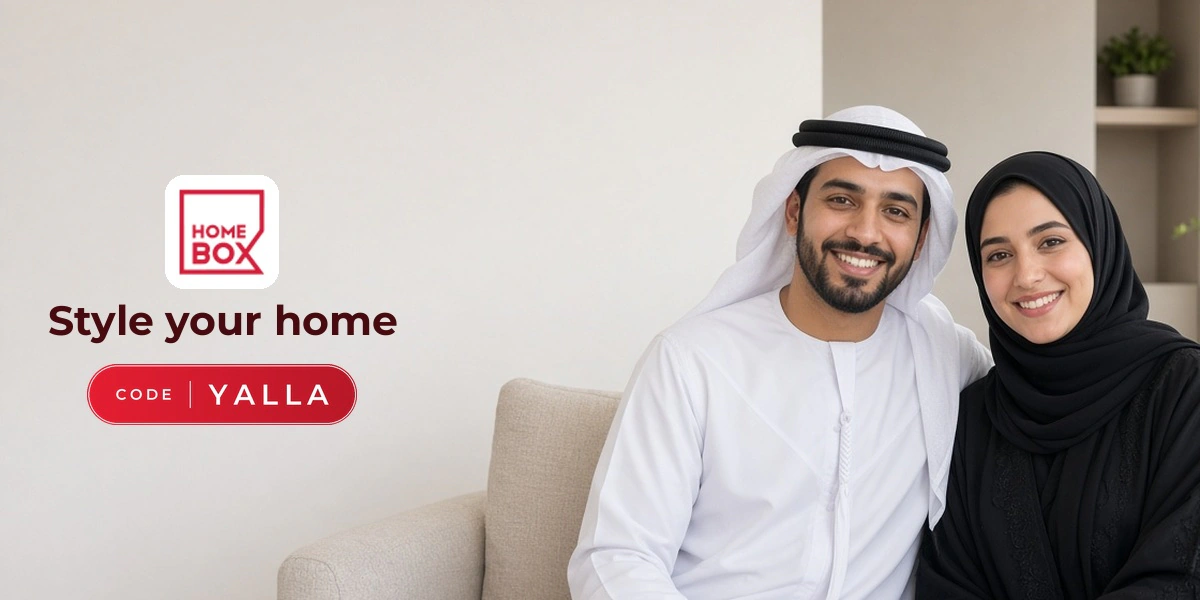 Home Box promo code YALLA banner with shoppers enjoying home furniture