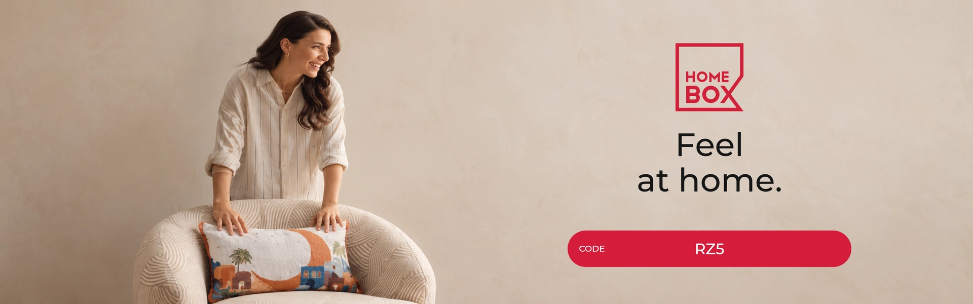 Home Box promo code RZ5 banner with shoppers enjoying home furniture