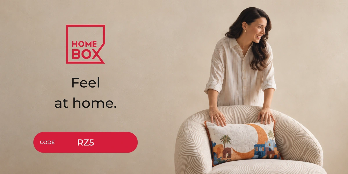 Home Box promo code RZ5 banner with shoppers enjoying home furniture